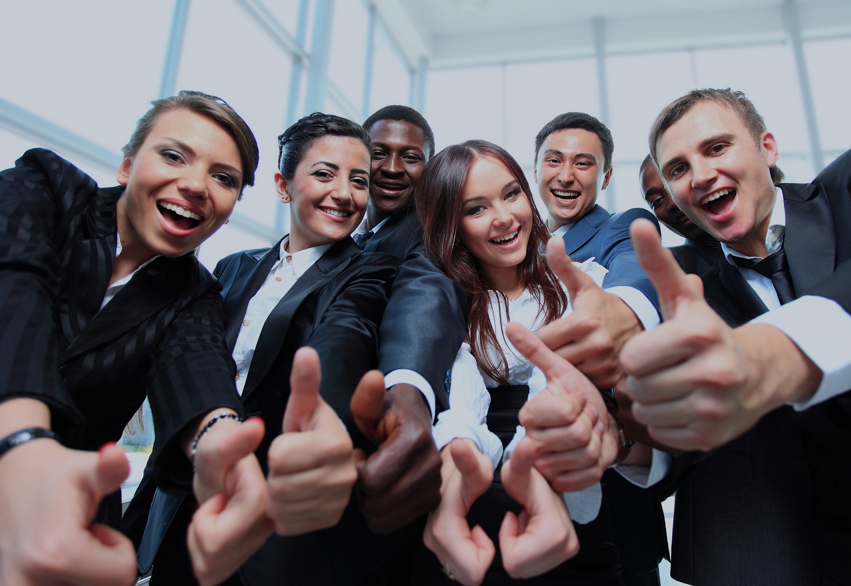 Group of people giving a thumbs up