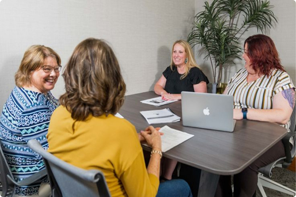 Group of people sitting around a table